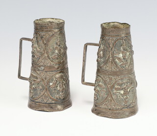 A pair of Indian white metal repousse tapered jugs 9cm 