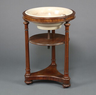 A Victorian circular mahogany basin stand with ceramic basin, raised on turned and fluted column, triform base 81cm h x 56cm 