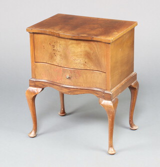 A Queen Anne style walnut sewing box of serpentine outline, the hinged lid revealing a fitted interior, the base a drawer, raised on cabriole supports 63cm h x 53cm w x 37cm d 