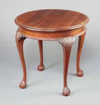 An Edwardian circular Chippendale style mahogany occasional table raised on cabriole claw and ball supports 69cm h x 74cm diam. 