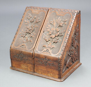 An Anglo Indian Victorian carved hardwood stationery box of wedge form and having a stepped fitted interior, the base fitted a drawer 36cm h x 38cm w x 28cm d  