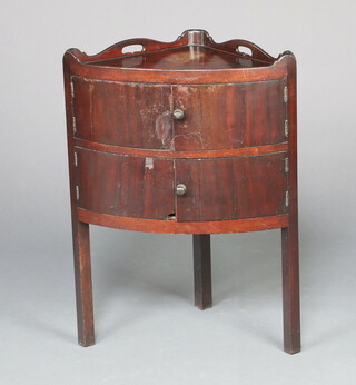 A Georgian mahogany bow front double wash stand with raised 3/4 gallery, the upper section enclosed by a panelled door above cupboard enclosed by a panelled door, raised on square supports 75cm h x 55cm w x 38cm d 