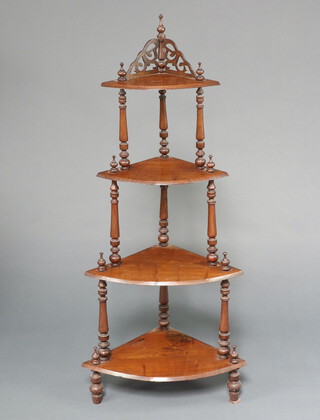 A Victorian oak 4 tier corner what-not, raised on turned supports 138cm h x 61cm w x 42cm d 