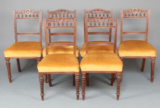 A set of 6 Victorian carved walnut bar back dining chairs with bobbin turned decoration and overstuffed seats, raised on turned supports 91cm h x 49cm w x 44cm d 