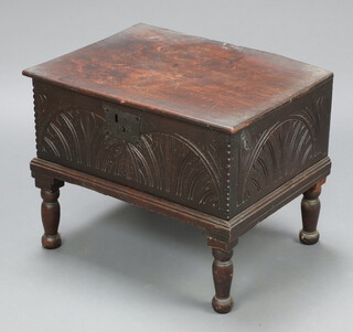 An 18th Century carved oak bible box with hinged lid and iron lock front, raised on later turned supports 47cm h x 60cm w x 45cm d 