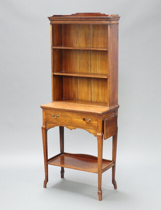 An Edwardian Art Nouveau oak bookcase on stand with moulded cornice, fitted 2 shelves, the base with 1 long drawer and flaps to the side, raised on outswept supports with undertier 153cm h x 61cm w x 34cm d  