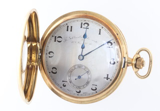 An 18ct yellow gold half hunter pocket watch with seconds at 6 o'clock, the dial partly inscribed The Goldsmiths and Silversmiths ?, the case numbered 5118, contained in a 47mm case the back inscribed "To Chas E Evans From The Directors Of Bemrose  & Sons Ltd As A Token Of A Long And Happy Association 1904-1931" complete with original fitted box and together with yellow metal 9ct mounted silk Albert 