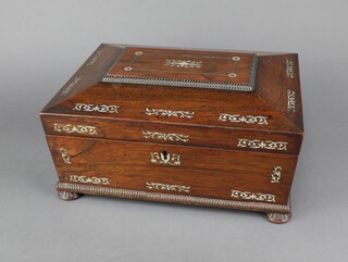 A Victorian rosewood and inlaid mother of pearl trinket box of sarcophagus form, raised on bun feet 13cm h x 29cm w x 23cm d 