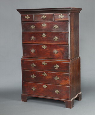 A Georgian mahogany chest on chest with moulded cornice and fluted canted corners, fitted 3 short drawers above 3 long drawers with original drop handles 173cm h x 105cm w x 53cm d 