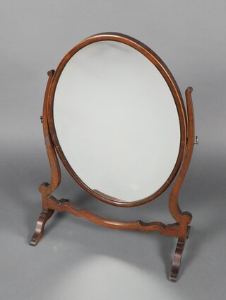 A 19th Century oval bevelled plate dressing table mirror contained in an inlaid mahogany frame 70cm h x 50cm w x 26cm d 