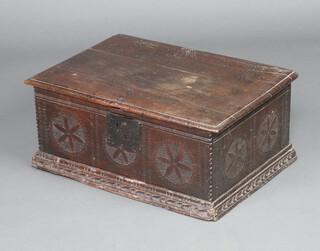 A 17th Century carved oak bible box with hinged lid and iron lock 27cm h x 63cm w x 44cm d 