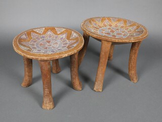 A pair of Ethiopian circular stools with turquoise and polished stone inlay 33cm h x 36cm diam. and 30cm x 34cm  diam. 