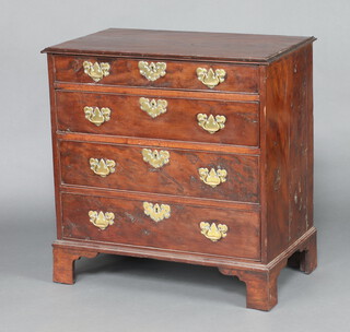 A Georgian yew chest, the top and sides constructed of 3 panels, fitted 4 long drawers with steel locks, brass escutcheons and replacement brass swan neck drop handles, raised on bracket feet 85cm h x 82cm w x 48cm d  