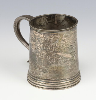 A Victorian silver mug with engraved monogram and S scroll handle, London 1899 8cm, 166 grams