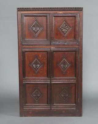 An oak double corner cabinet constructed of old timber with moulded cornice, enclosed by panelled doors, 160cm h x 92cm w x 68cm d 