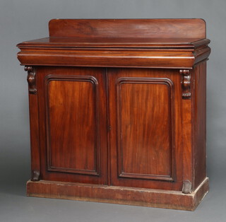 A Victorian mahogany chiffonier with raised back above secret drawer and cupboard enclosed by arched panelled doors, raised on a platform base 126cm h x 127cm w x 51cm d 