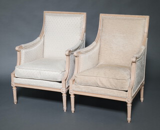 A near pair of French style white painted salon chairs upholstered in white material  97cm h x 67cm w x 62cm d  