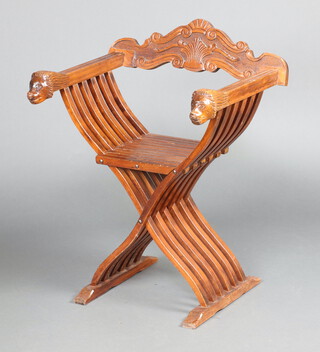 An Italian style carved beech X framed folding chair with lion mask arms 80cm h x 61cm w x 50cm d 