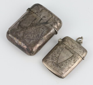 A Victorian silver vesta with engraved monogram London 1886 together with a smaller engraved ditto Birmingham 1907, 53.9 grams 