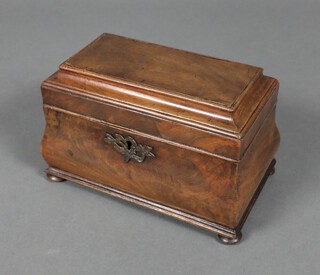 A Georgian rectangular mahogany twin section tea caddy with hinged lid and brass escutcheon, raised on bun feet 17cm x 25cm x 15cm  