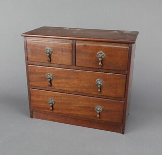 An Edwardian mahogany "apprentice" chest of 2 short and 2 long drawers with gilt metal pear drop handles 21cm h x 24cm w x 12cm d 