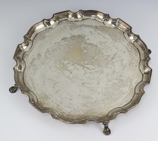 A silver salver with Chippendale rim on pad feet Birmingham 1936, 504 grams 