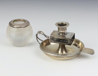 An Edwardian silver ashtray combined with a match sleeve holder and candlestick Birmingham 1901, together with an Edwardian style silver mounted glass match striker 