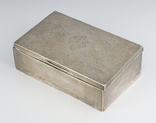 A rectangular silver cigarette box with engraved monogram, rubbed marks, 14cm 