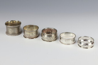 A Victorian silver napkin ring London 1876, 4 others, 90 grams