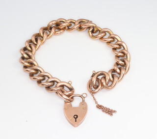 A 9ct yellow gold bracelet with ditto padlock, 18cm, 14.5 grams 