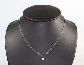 A white metal 18k single stone diamond pendant approx. 0.5ct on a ditto chain, 5 grams 