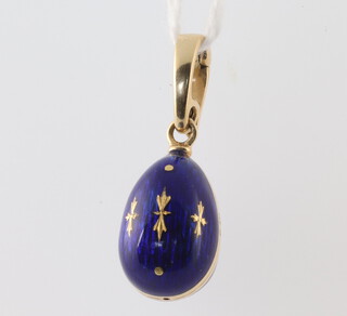 Faberge, a yellow metal 750 blue guilloche enamel egg pendant, numbered 348 of 500, 3.8 grams, 25mm from the top of loop, boxed and with certificate