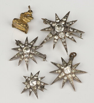 Four Victorian white metal paste set star brooches and a gilt seal 