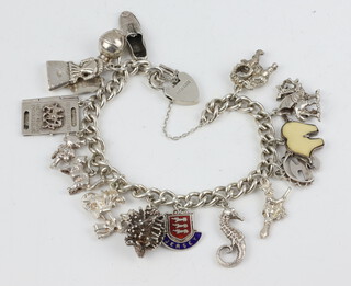 A silver charm bracelet 58 grams