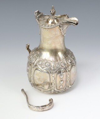 A Victorian repousse silver hot water jug Sheffield 1858, 328 grams gross 