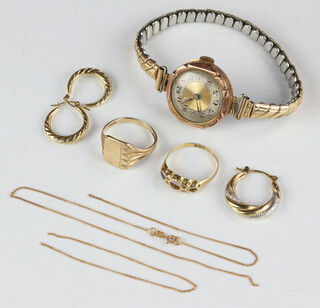 A lady's 9ct yellow gold wristwatch, a pair of earrings and minor gold jewellery, weighable gold 7.6 grams 