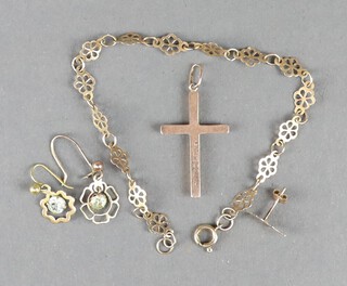 A 9ct yellow gold cross pendant and a ditto bracelet 18cm, 3 yellow metal earrings, 2.7 grams 