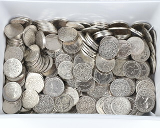 A quantity of polished 2 shilling coins, mixed dates 