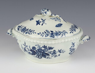 A first period Worcester blue and tureen and cover with artichoke handle and twin swept shell handles the cover with butterflies and flowers, the base and interior with flowers 26.5cm