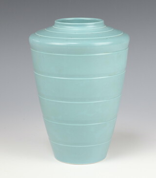 A Keith Murray Wedgwood pale blue tapered ribbed vase, printed marks, 19cm