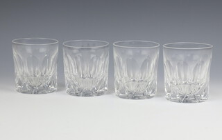 A set of 4 heavily cut glass tumblers 10cm 