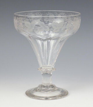 A 19th Century drinking glass with engraved vinous decoration and ring stem with spread foot base 19cm 