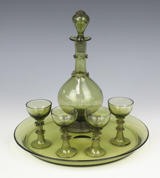 A German pale green glass liqueur set comprising decanter and stopper, 4 tots and a tray 