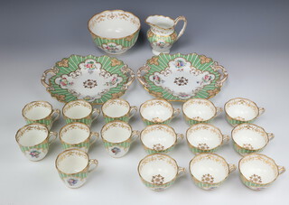 A Victorian tea and coffee service decorated with green gilt and spring flowers comprising 7 coffee cups, 9 tea cups, milk jug (a/f), slop bowl and 2 sandwich plates