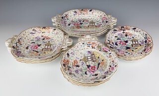 A Victorian Rockingham part dessert service comprising 1 tazza (cracked and broken), 4 shallow dishes (2 a/f), 3 serving dishes and 3 larger serving dishes, together with 4 plates (1 cracked) decorated in New Chinoiserie design 