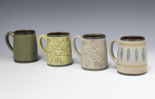 Four Mirek Smisek (New Zealander 1925-2013), glazed and incised mugs 