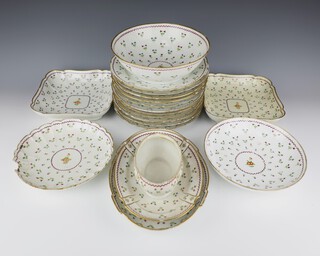 A 19th Century Andre-Marie LeBoeuf French porcelain dessert service comprising 11 dinner plates (2 plates chipped, 4 are cracked), 2 square bowls (1 is stuck, 1 is chipped), 2 circular bowls (both are chipped, 1 is cracked), an oval dish and a tureen base (chipped and with no lid) all decorated with green flowers 