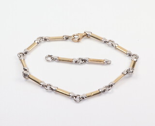 A yellow and white metal bracelet with 2 extra links, 18cm 