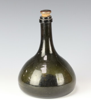 An 18th Century green glass onion decanter of bulbous form 22cm with later stopper