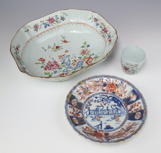 Three Chinese export wares, comprising a famille rose oblong octagonal bowl, Qing Dynasty, Qianlong periods, painted with a peony and rockwork, a Chinese Imari dish, Qing dynasty, Kangxi period, painted with two ladies and a famille rose cup painted with peony 31.3w, 21.5cm diam and 7cm h respectively